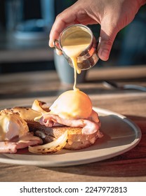 Eggs Benedict, hollandaise sauce, cheese toastie, toasty, ham, pastrami, pickles, food styling, food plating
					