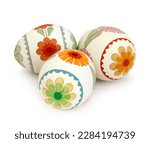 Eggs decorated with floral patterns on a white background