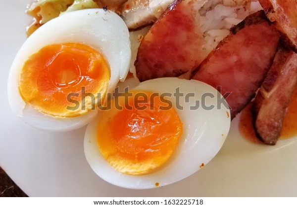 Eggs divided in half in a\
dish.