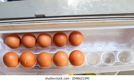 Eggs In The Egg Tray Of The Refrigerator