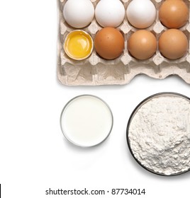 Eggs, Glass Of Milk And Flour Isolated On White Background