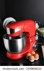 Eggs Near Modern Stand Mixer On Countertop In Kitchen