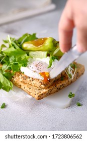 Eggs On Wholemeal Toast With Runny Egg Yolk.