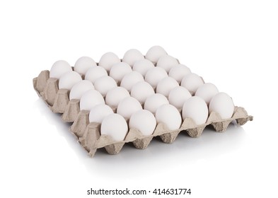 Eggs in paper tray isolated on white