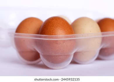 Eggs in plastic container closeup