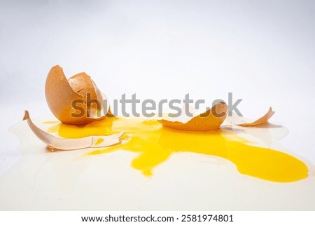 eggs that are broken because they fell and scattered on the floor. white background.
