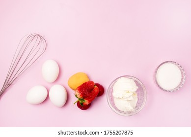 Eggs Whites Cream Cheese Whisk Sugar Fruits and Strawberry Ingredients for Pavlova Cake Step by step Recipe of Pavlova Cake Top View
