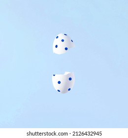 Eggshells against pastel blue background. Minimal creative Easter layout. - Powered by Shutterstock