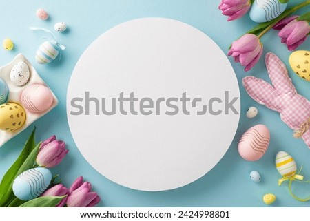 Eggstra special Easter display: top view of vibrant eggs, sweet bunny, and tulips on a pastel blue canvas. Empty circle ideal for conveying Easter wishes or showcasing springtime promotions