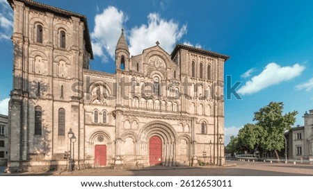 Eglise Abbatiale Sainte-Croix timelapse hyperlapse in Bordeaux, France, Romanesque Catholic church with a medieval facade. Landmark showcases rich architectural and cultural heritage under a blue sky