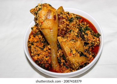 Egusi Stew is a popular West African dish. Grounded melon seeds cooked in a tomato and pepper based stew with most times Spinach as the greens or other African greens and herbs