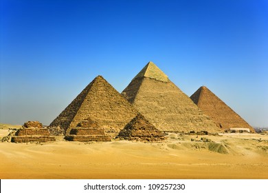 Egypt. Cairo - Giza. General view of pyramids from the Giza Plateau (three pyramids known as Queens' Pyramids, in background: the Pyramid of Menkaure /Mykerinos/, Khafre /Chephren/ and Chufu /Cheops/)