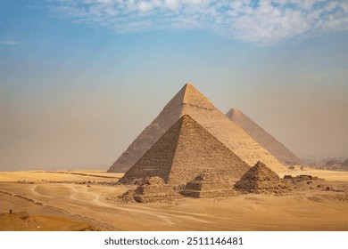 Egypt. Cairo - Giza. General view of pyramids from the Giza Plateau (three pyramids known as Queens' Pyramids on front side; next in order from left: the Pyramid of Menkaure, Khafre and Chufu