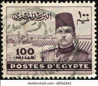 EGYPT - CIRCA 1939-1946: A Stamp Printed In Egipt Shows Farouk I Of Egypt And Aswan Dam, Circa 1939-1946