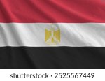 Egypt flag depicted on folded wavy fabric of old cloth close up