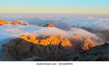 
				Egypt Mount Moses (Mount Sinai). Magnificent sunrise. View from the top of the mountain.
