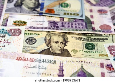 Egypt national currency with USA dollar banknote backdrop. Money banknotes. Egyptian pounds banknotes 100 LE and 200 pounds with American dollars 100 dollars and 20 dollar bill, money exchange rate 