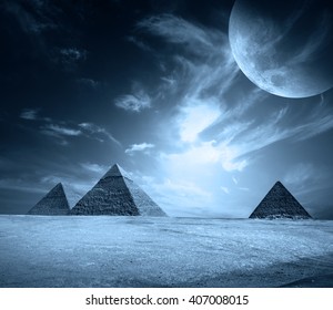 Egypt pyramids on a black sky with moon. Elements of this image furnished by NASA.