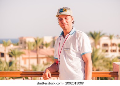 Egypt, Sharm El-Sheikh - 14.06.2021. Resort Hotel Staff Portrait At Summer Vacation Hotel Buildings Background