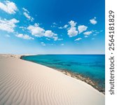 Egypt - the spectacular Mediterranean coast with the desert sand dunes contrasting with the blue color of the sea between Sidi Abdel Rahman and El Alamein