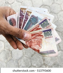 Egyptian Currency In Hand.