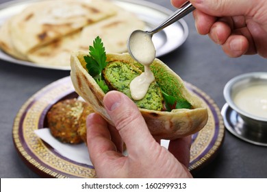 Egyptian Falafel Served In A Pita Bread With Tahini Sauce