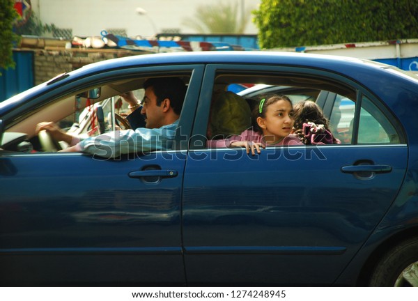 An Egyptian\
family travels with their car. The Arab Spring begins. Cairo,\
Egypt, Middle East, March 25,\
2011