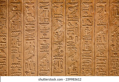 Egyptian hieroglyphs on the wall - Shutterstock ID 239983612