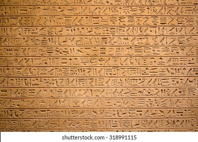 Egyptian hieroglyphs on the wall - Shutterstock ID 318991115