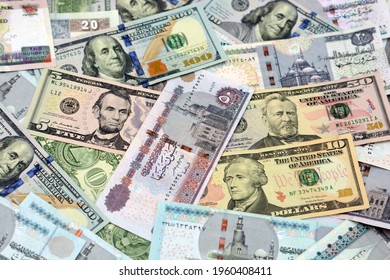 Egyptian money with American money different banknotes background, American dollars (100 dollars, 50, 10,5 and 1 dollar) Egyptian banknotes (200 pounds, 100, 50, 20, 10 and 5 pounds), selective focus.