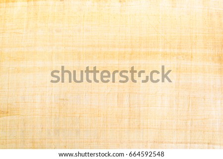 Egyptian papyrus paper texture background. Papyrus is used in ancient times as writing surface, made from the pith of papyrus plant named Cyperus papyrus, widely used across the Mediterranean region.