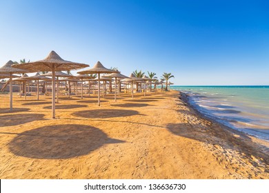 Egyptian Parasols On The Beach Of Red Sea