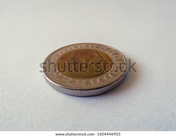 The Egyptian pound is the currency of Egypt. It is\
divided into 100 piastres, or ersh or 1,000 milliemes. Coin on\
white background. - Imge