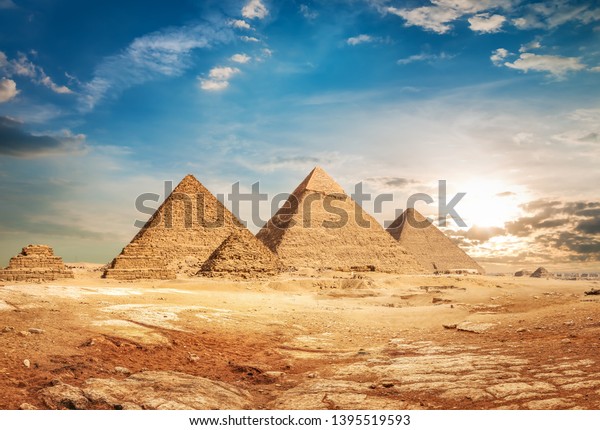 Egyptian pyramids\
in sand desert and clear\
sky