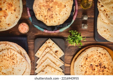 Egyptian traditional bread "Aish Baladi". Collection of Egyptian flatbread. This vegan bread is a mixture of whole wheat flour, yeast, salt and water. Top view with close up.
 - Shutterstock ID 2216943955