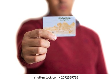 Egyptian Youngman Holding Empty National ID with Arabic words Arab Republic of Egypt, Personal ID - Shutterstock ID 2092589716