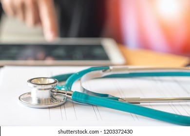E-Health Doctor concept. Professional medical physician with stethoscope using tablet computer connecting with patient consulting in clinic hospital. Medical/ healthcare/ technology concept