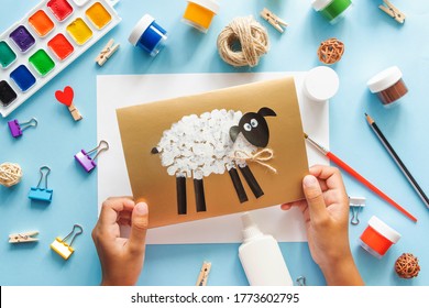  Eid Al Adha Lamb Sheep Baby Craft On Blue Background. Gift Idea, Decor Eid Al Adha. Step By Step. Top View. Process Kid Children Craft.