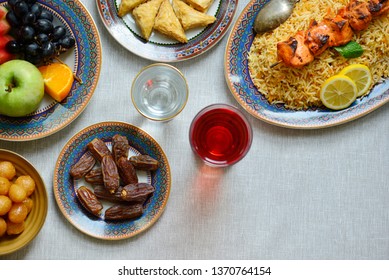 Eid Al Fitr - Festival Of Breaking The Fast.  Biryani, Dates Fruits And Sherbet Spread Shot From Above. Breaking Fast In The Evening During Holy Month Of Ramadan With Nutritious Food.