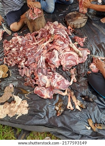 Eid al-Adha al-Mubarak meat sacrificed animal. meat raw lamb lying on plastic isolated on black background
