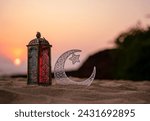 Eid Mubarak background design, Ramadan Lantern Lamp, crescent moon with sunset sky, Islamic concept image

