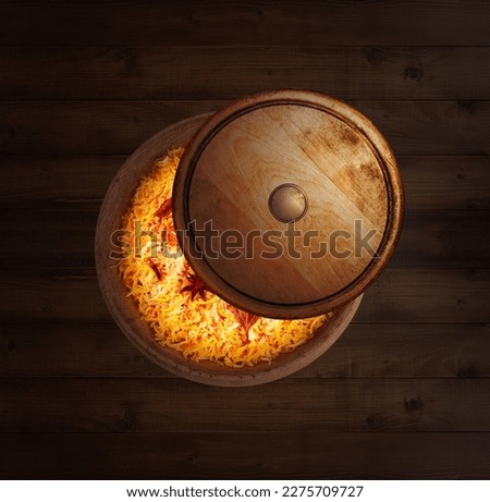 Eid Mubarak (Blessing for Eid): A Creative poster for Eid with Moon and iftar meal together. Food Concept. Yummy Biryani.