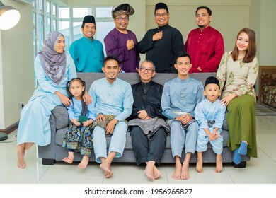 Eid Mubarak Celebration Moment, Big Family Photo At The Sofa Wearing Traditional Cloth. Happy Asian Family