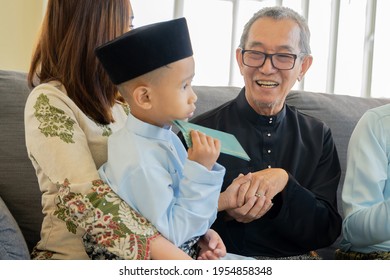 Eid Mubarak Celebration Moment, Grand Father With Grand Son At The Sofa