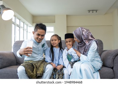 Eid Mubarak Celebration Moment, Malay Family Taking Selfie For Sweet Memories