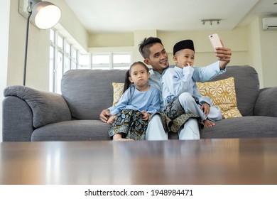 Eid Mubarak Celebration Moment, Malay Family Taking Selfie For Sweet Memories