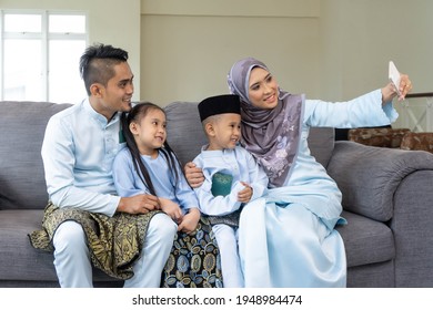 Eid Mubarak Celebration Moment, Malay Family Taking Selfie For Sweet Memories