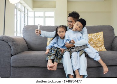 Eid Mubarak Celebration Moment, Malay Family Taking Selfie For Sweet Memories