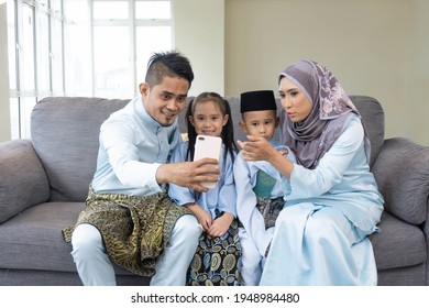 Eid Mubarak Celebration Moment, Malay Family Taking Selfie For Sweet Memories