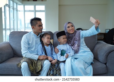 Eid Mubarak Celebration Moment, Malay Family Taking A Selfie.